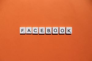 Facebook scrabble letters word on a orange background