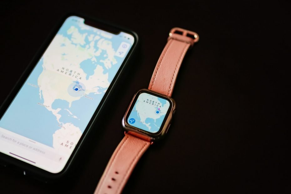 iPhone with map of North America next to Apple Watch with matching map on black background